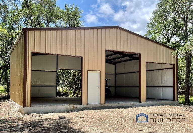 Metal building with roll-up doors, walk door and roof extension — Texas Metal Builders